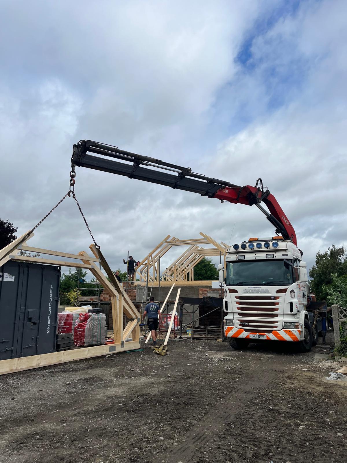 HIAB crane lifting roof truss